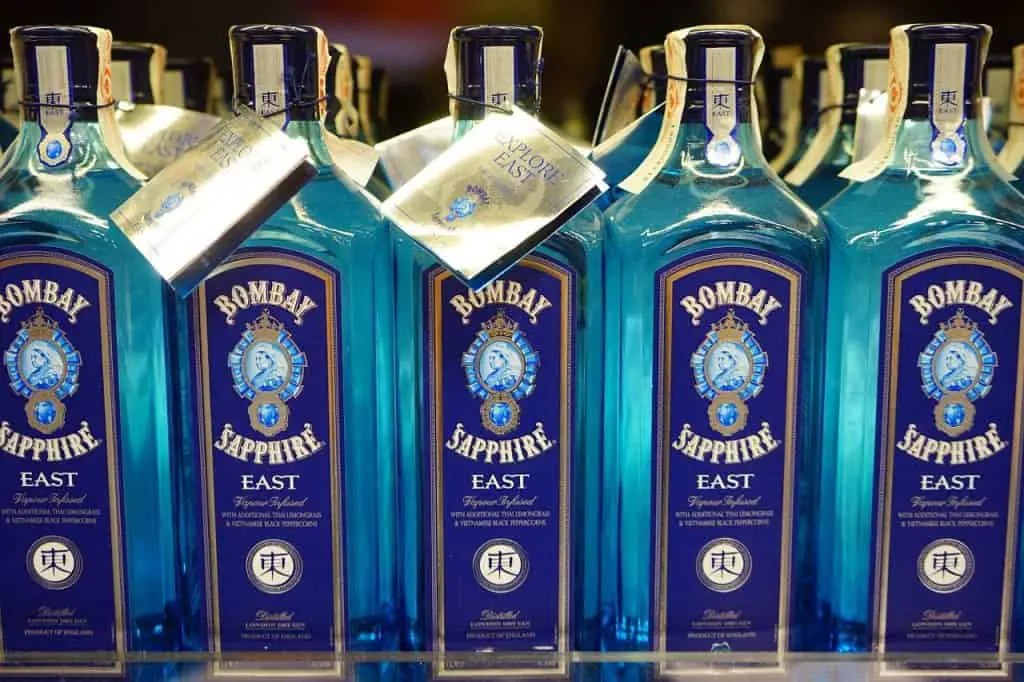 Several rows of Bombay Sapphire gin bottles.