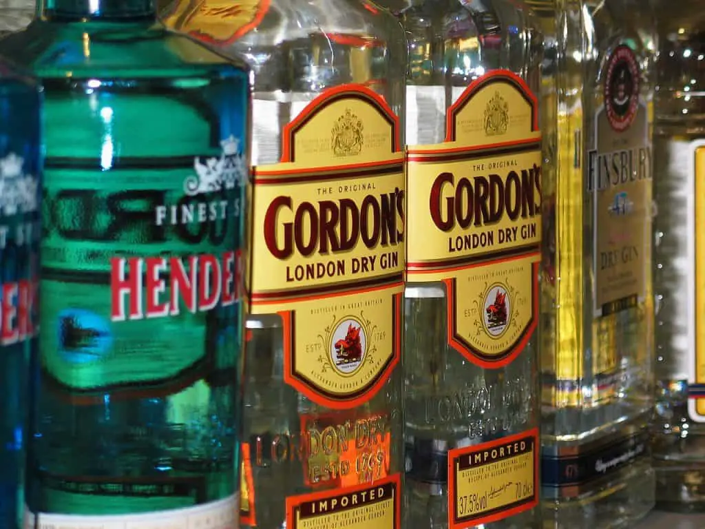 Close-up view of several bottles of alcohol including Gordon's Gin.