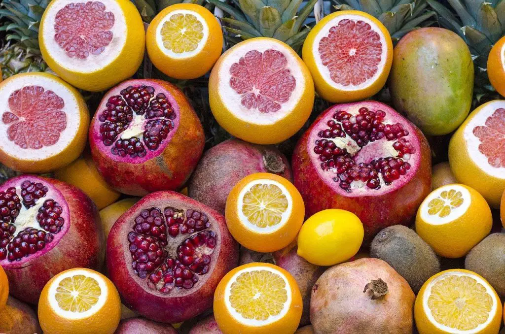 A large collection of different citrus fruits including lemons, grapefruit and blood orange.